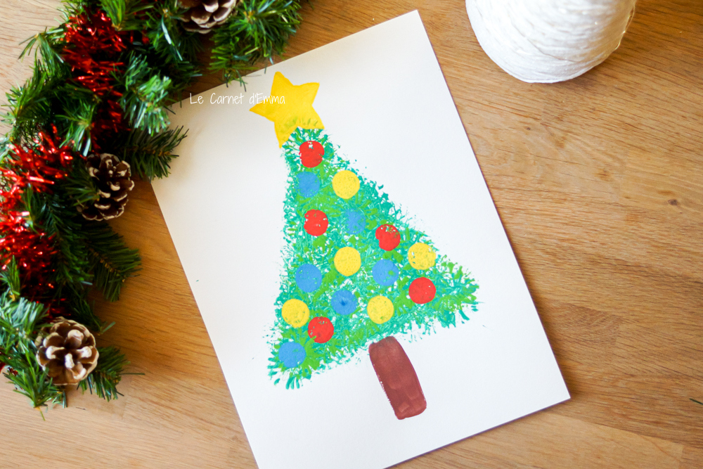 Activité manuelle sur le thème de Noël avec un sapin peint avec une paille